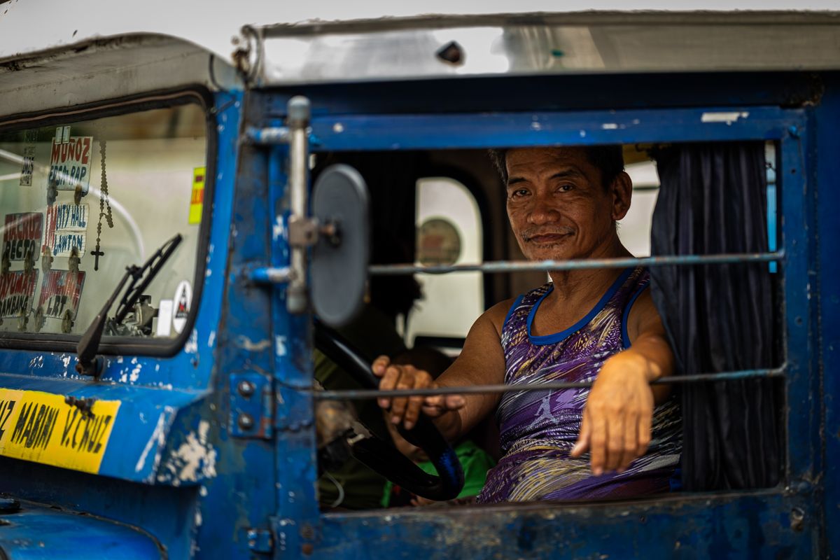 A local driver at the wheel of his jeepney